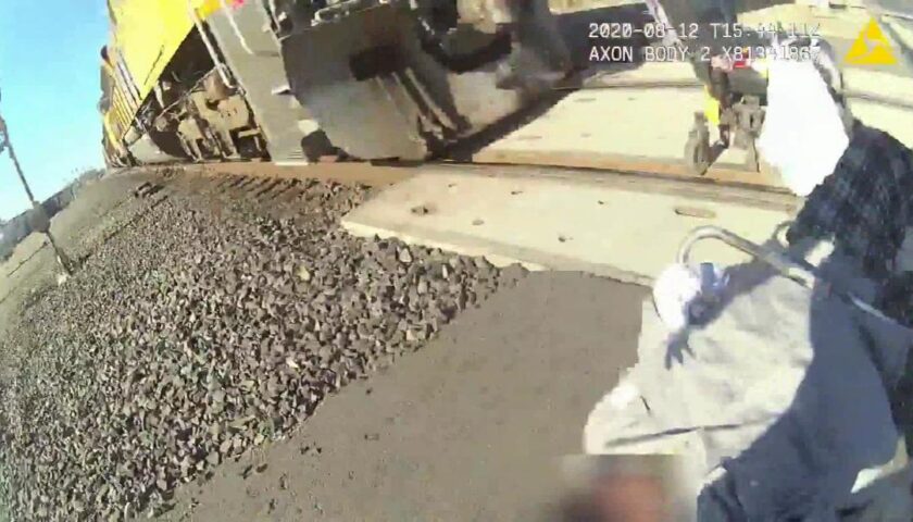 An officer saved a man in a wheelchair stuck on train tracks. Her bodycam shows the rescue