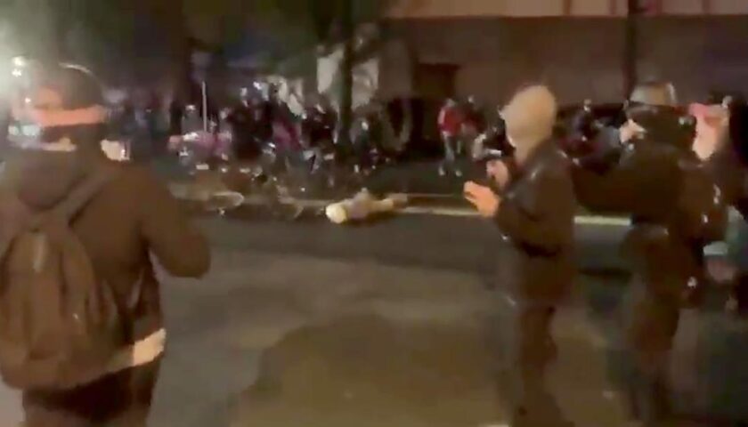 Police officer shown on video riding bike over a protester's head placed on leave