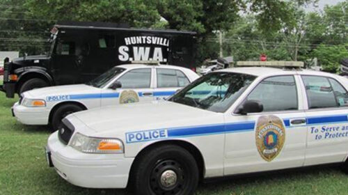 Police face questions after a woman's body is found in a police van